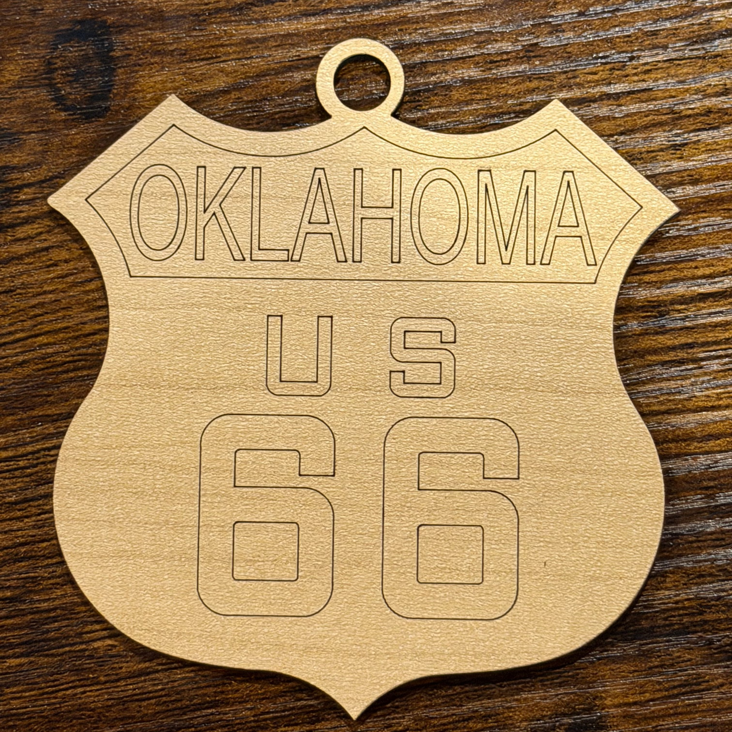 Wooden Oklahoma license plate on a wooden surface