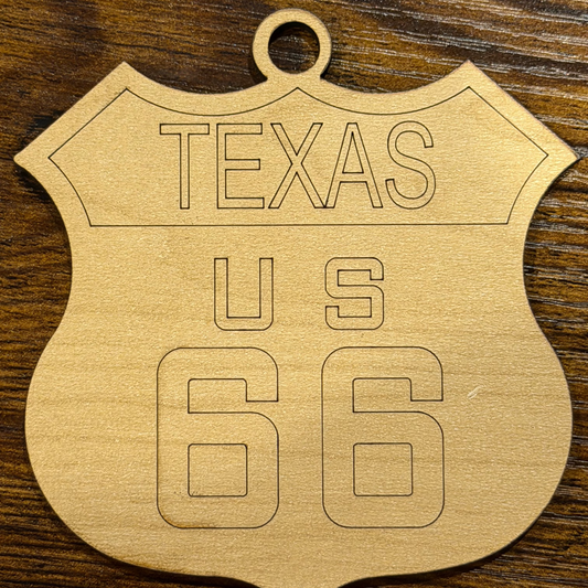 Wooden ornament with 'Texas US 66' engraving on a wooden background