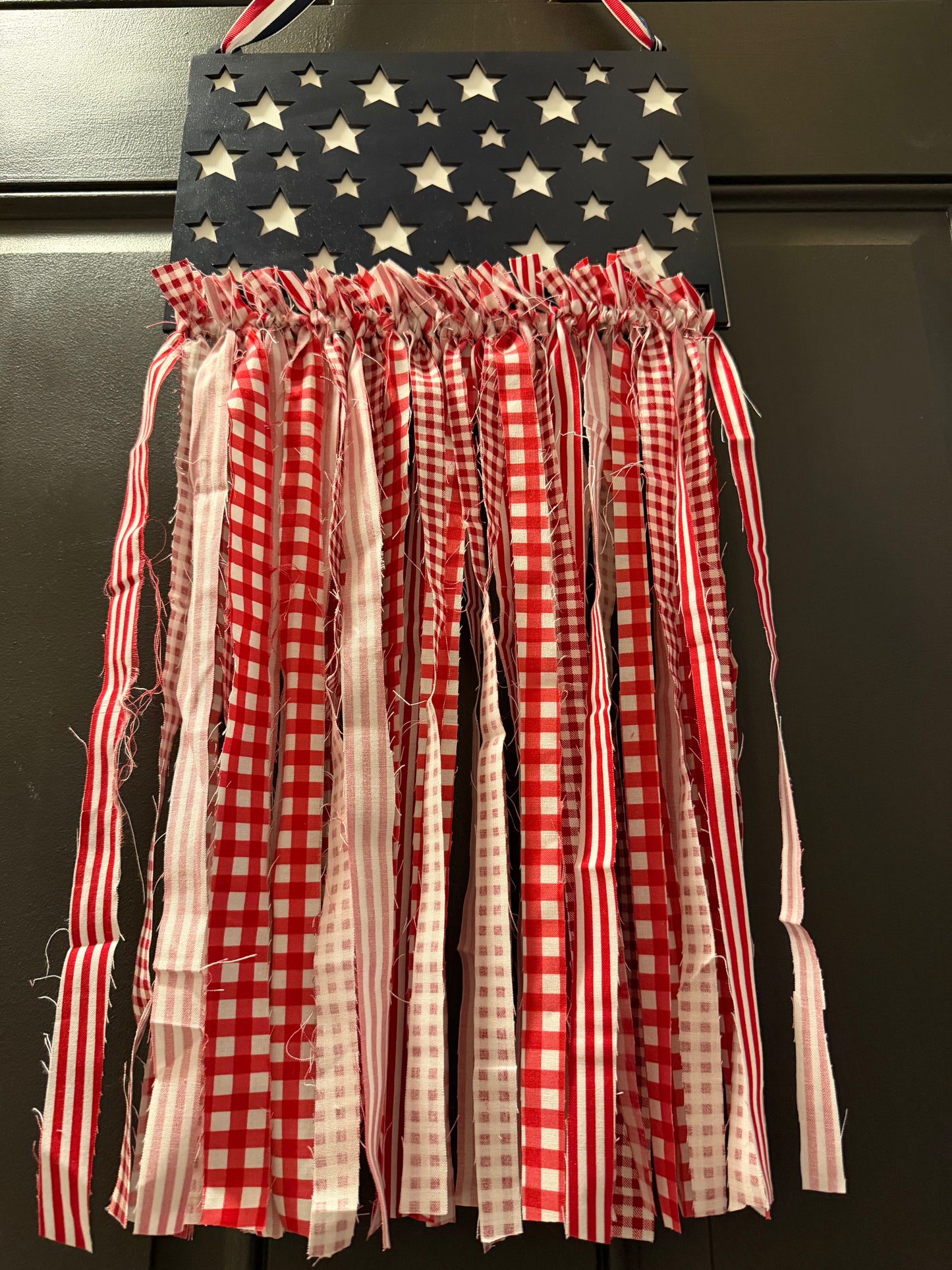 Decorative wall hanging with American flag design and checkered fabric