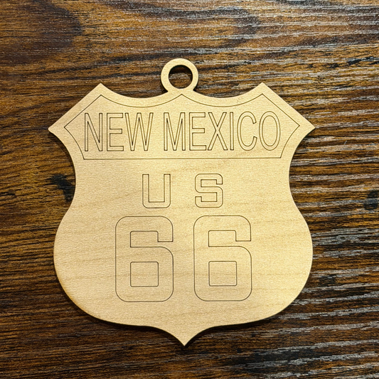 Wooden ornament with 'New Mexico U.S. 66' text on a wooden surface
